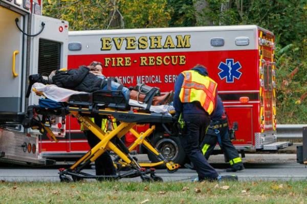 Medics remove an injured person after the New Jersey Transit train crash on Monday.