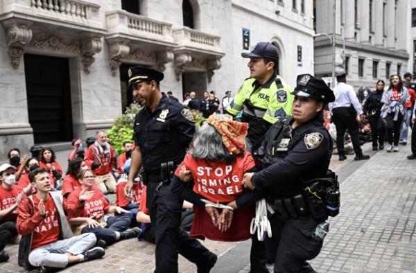 Police arrest a protester outside the New York Stock Exchange.