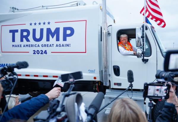 Former President Do<em></em>nald Trump holds a press co<em></em>nference from inside a trash hauler on Oct. 30, 2024, in Green Bay, Wisconsin.