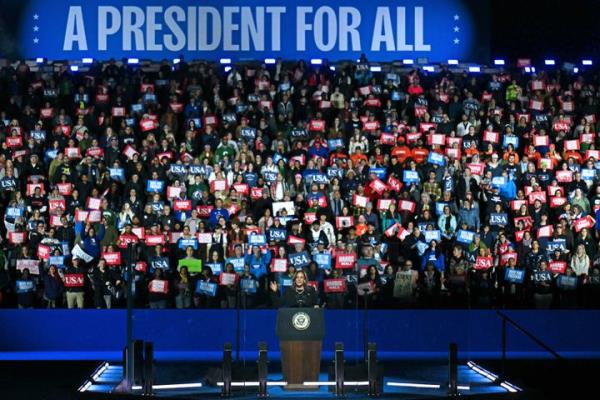 Harris spoke in front of a crowd holding red, white and blue placards, and a sign that said 