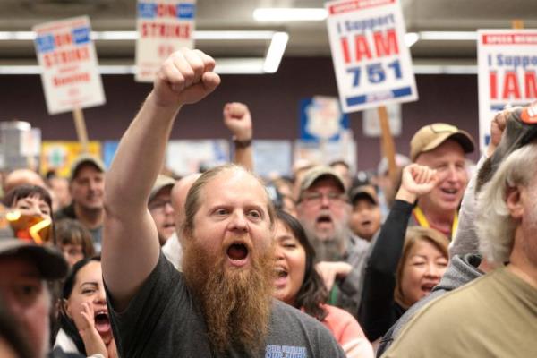 Ryan Bergh, a machinist at Boeing's factory in Everett, Washington, for 10 years, cheers during a strike rally for the Internatio<em></em>nal Association of Machinists and Aerospace Workers (IAM) at the Seattle Unio<em></em>n Hall in Seattle, Washington, on Oct. 15.