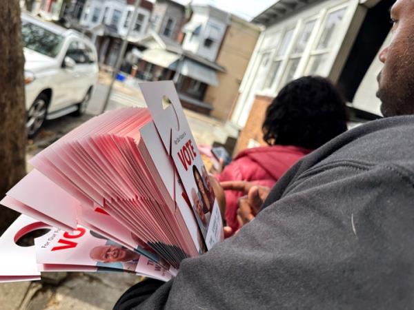 Vero<em></em>nica Bell and Brian Phelps canvass a neighborhood in North Philadelphia in late October. They two of a number of volunteer and paid canvassers allied with Democrats in a key swing state.