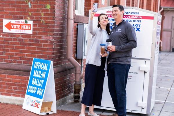 Above, a couple takes a selfie after dropping ballots in a ballot box on November 8, 2022. In Washington D.C., you are allowed to take a selfie of your own ballot. 