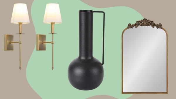 A pair of antique brass sconces, a modern decorative vase and a baroque-style accent mirror.