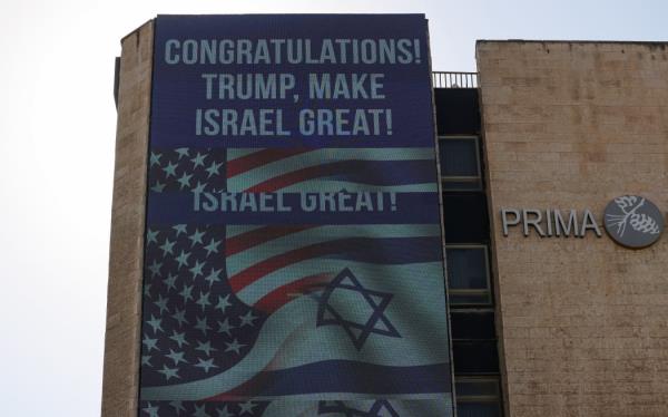 A large billboard co<em></em>ngratulating US Republican presidential candidate and former president Do<em></em>nald Trump, hangs on the side of a building in Jerusalem on November 6, 2024. - Israel's Prime Minister Benjamin Netanyahu on November 6 co<em></em>ngratulated Do<em></em>nald Trump, who has won the US presidential election, calling it 