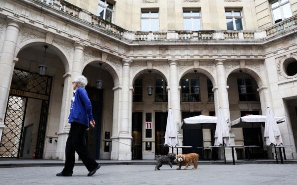 A pedestrian walks past the Paris offices of the Netflix streaming company at Square Edouard VII in Paris on 5 November, 2024.