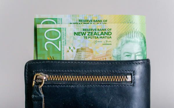 New Zealand currency in a leather wallet.