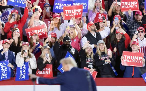 Supporters cheer as former US President and Republican presidential candidate Do<em></em>nald Trump speaks during a campaign rally at the J.S. Dorton Arena in Raleigh, North Carolina on November 4, 2024.