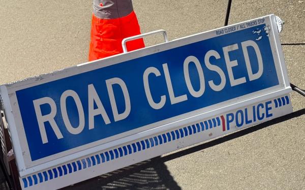 A sign saying 'road closed'.