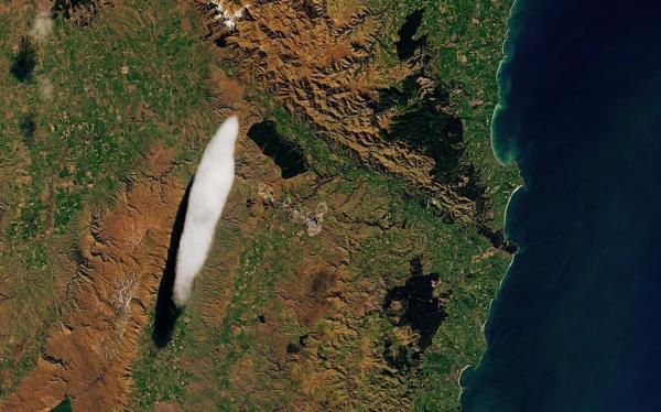 A satellite image of a small, skinny, oval-shaped cloud above the Taieri region.