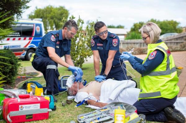 Paramedics providing CPR to a person in cardiac arrest.