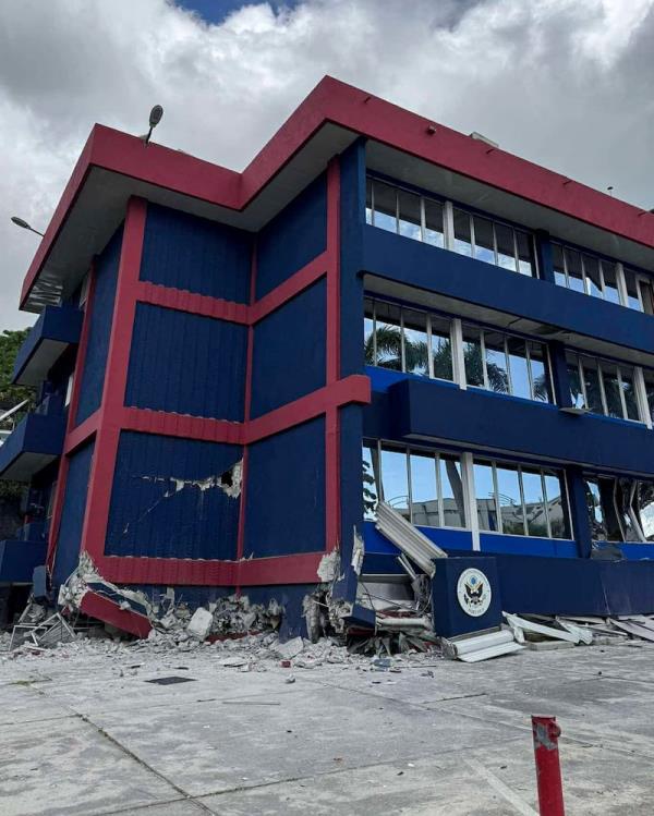 A damaged building in Port Vila, Vanuatu, as rescue efforts co<em></em>ntinued (Tim Cutler via AP)