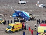 A drone view shows emergency specialists working at the crash site of an Azerbaijan Airlines passenger plane near the city of Aktau, Kazakhstan. (IMAGE: REUTERS)