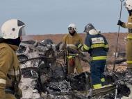 Emergency specialists work at the crash site of an Azerbaijan Airlines passenger plane near the city of Aktau, Kazakhstan. (IMAGE: REUTERS)