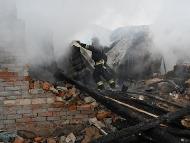 A rescuer of the State Emergency Service works to put out a fire in a private house after a drone strike in Kharkiv. (IMAGE: AFP)