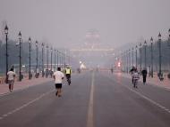 People jog at Kartavya Path as air quality co<em></em>ntinues to remain poor in New Delhi. (PTI photo)