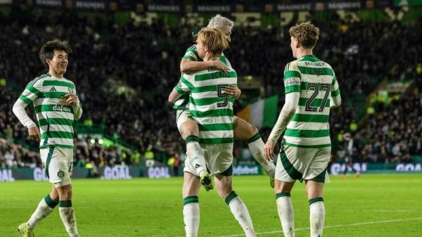 Liam Scales celebrates Celtic's second with goalscorer Daizen Maeda