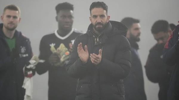 Ruben Amorim applauds the travelling fans at Molineux