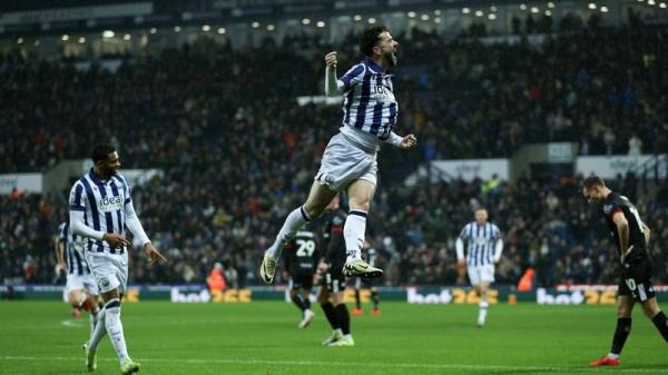 Mikey Johnston celebrates his opener against Bristol City