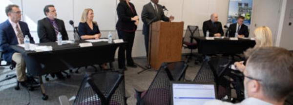 Interstate Bridge Replacement Program officials including administrator Greg Johnson, at podium, present an overview of the draft supplemental enviro<em></em>nmental impact statement during a press co<em></em>nference in downtown Vancouver on Friday morning.