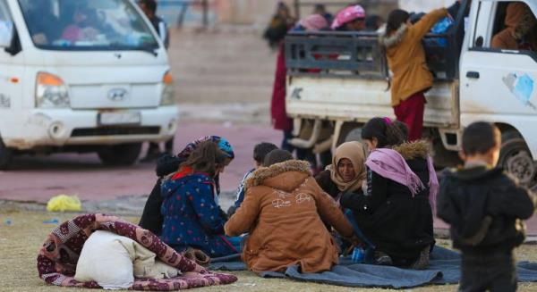 A family gathers at a reception centre in Ar-Raqqa city, Syria.