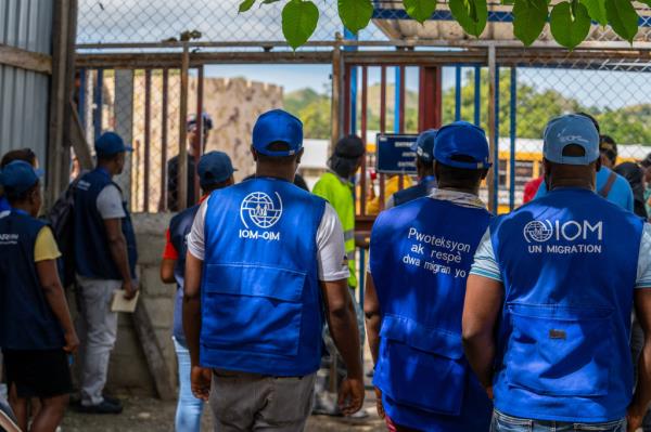 IOM staff prepare to assist deported Haitians as they re-enter their home country.